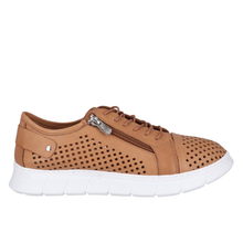 A tan leather sneaker with a perforated upper, side zipper, and a thick white sole.