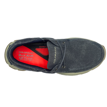 The Colorado Kanebo boat style shoe with a sneaker style sole made from EVA and rubber providing low slip traction. The shoe is made from a dark navy blue denim canvas.