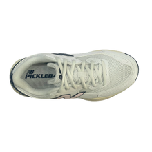 Top view of a New Balance ladies pickleball shoe. Suitable for tennis, pickleball and netball. Has a white mesh upper with a pink N and Navy heel and sole.