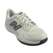 New Balance men's court shoe. Suitable for tennis, pickleball and netball. Has a white mesh upper with a black sole.