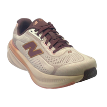 Diagonal view of the pink salt and pebble new balance 680 ladies sneaker with a soft pink stability bar and a burgundy tongue and lace. 