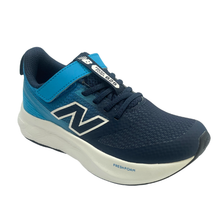 A New Balance kids' running shoe in navy blue and bright blue, featuring a white midsole and the signature 'N' logo on the side.