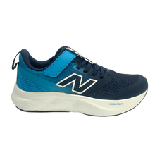 A New Balance kids' sneaker in navy blue and bright blue, featuring a white and navy 'N' logo on the side and a thick white midsole, shown against a plain white background.