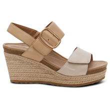 A women's wedge espadrille sandal featuring beige leather velcro straps with a gold-tone buckle, a braided jute wedge heel, and a cork midsole.