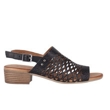 Cabello Alaca. A black perforated leather sandal with a small stacked leather heel.
