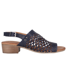 Cabello Alaca. A navy perforated leather sandal with a small stacked leather heel.