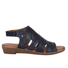 A navy blue leather perforated sandal with a low brown wedge heel, shown in a side profile view against a plain white background.