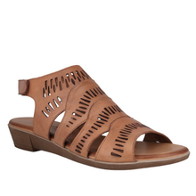 A tan leather strappy sandal with cutout details and a low wedge heel