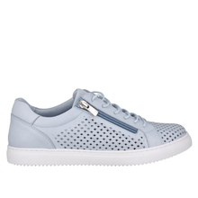 A light sky blue leather sneaker with perforated lattice patten details, a white sole, and a silver zipper on the side.