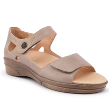 The Klouds Effie sandal. A taupe leather wedge sandal with a hook-and-loop strap closure and a decorative metal button. has two straps and a supported heel.