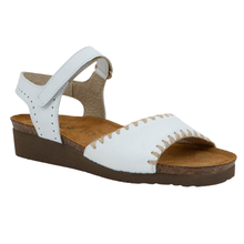 A single white leather wedge sandal with an adjustable ankle strap, a supportive cork midsole, and decorative beige stitching along the toe strap 