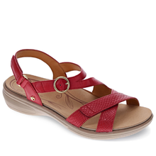 A red women's strappy sandal with an adjustable ankle strap, a decorative circular buckle, and floral details on the footbed. Footbed is removable for use of an orthotic.
