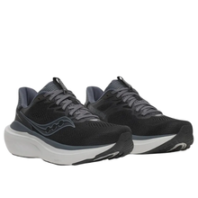 A pair of Saucony running shoes in black and dark gray with a thick white and gray sole, shown against a plain white background.