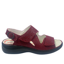 Simply Comfort Maddie. An adjustable three strap sandal with velcro on the front straps and a buckle on the heel. Features a soft removable insole. Orthotic friendly with a solid stable sole.