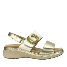 Suave dive. A women's orthotic friendly open-toe wedge sandal with gold and white straps, a gold-tone double-ring buckle detail, and a beige cushioned insole and sole.