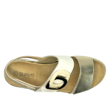 Suave dive. A women's orthotic friendly open-toe wedge sandal with gold and white straps, a gold-tone double-ring buckle detail, and a beige cushioned insole and sole.