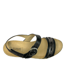 A black and taupe women's wedge espadrille look sandal with a metallic silver buckle on the ankle strap and a decorative chain-link pattern on the toe strap.