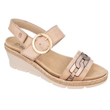 A sandy taupe women's wedge espadrille look sandal with a metallic gold buckle on the ankle strap and a decorative chain-link pattern on the toe strap.